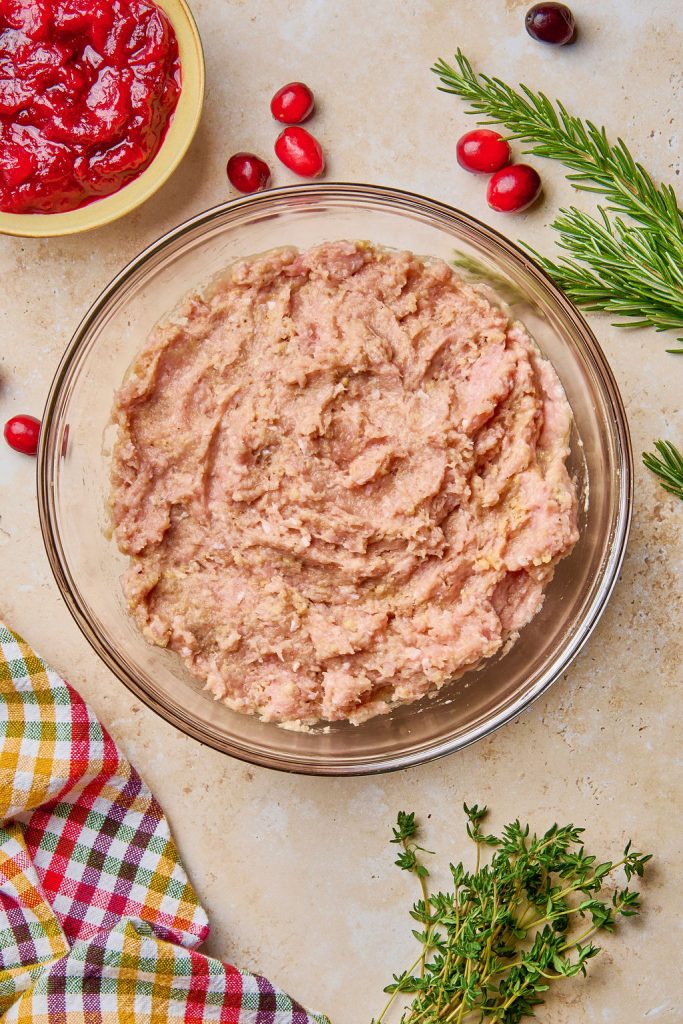 all the ingredients mixed together to create the meatball mixture