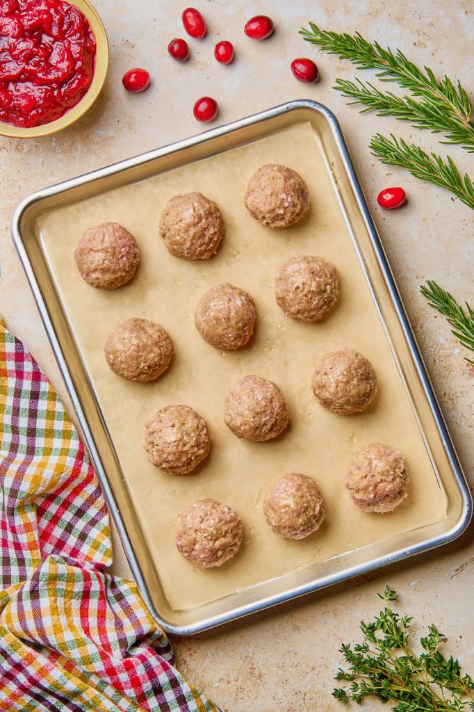 meatballs rolled into 1 inch balls and placed on baking sheet