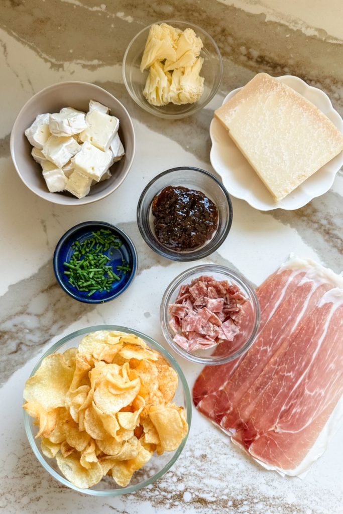 all the ingredients to make charcuterie nachos