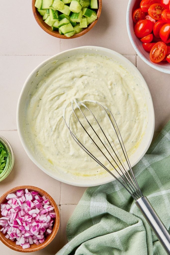 Boursin cheese dressing whisked together in a bowl
