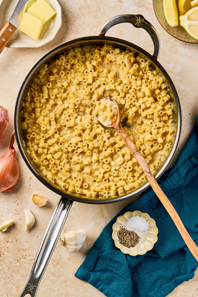 Parmesan cheese melted in the pasta in the skillet