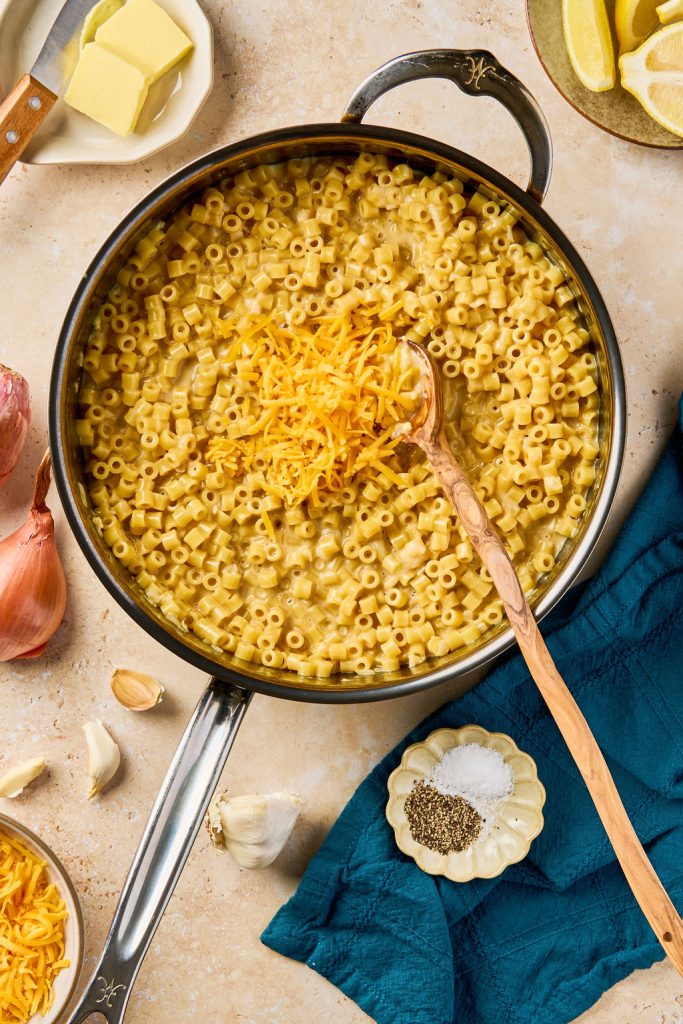 cheddar cheeses added to the pasta in the skillet