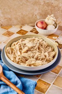 shredded chicken in a bowl on a counter