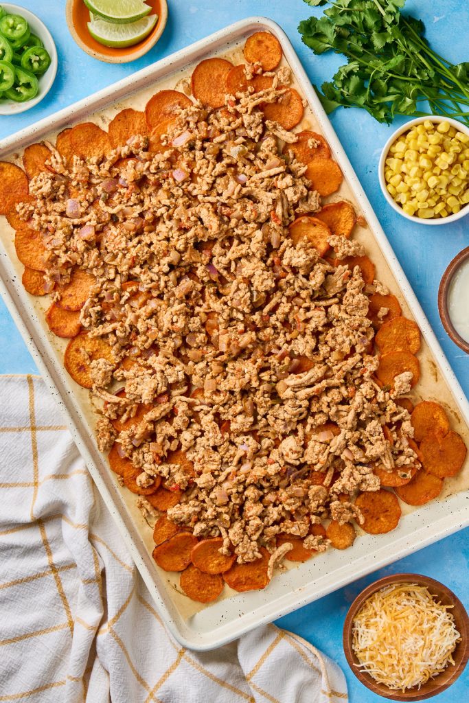 cooked ground turkey added to the sheet pan