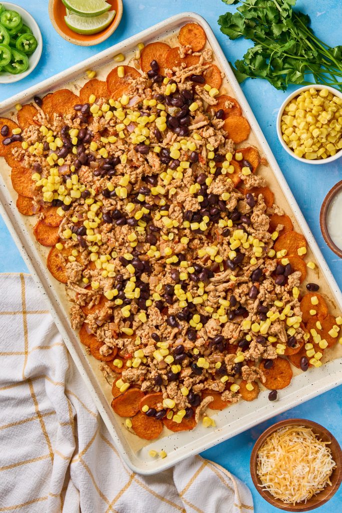 Turkey, beans and corn added to baked sweet potato rounds