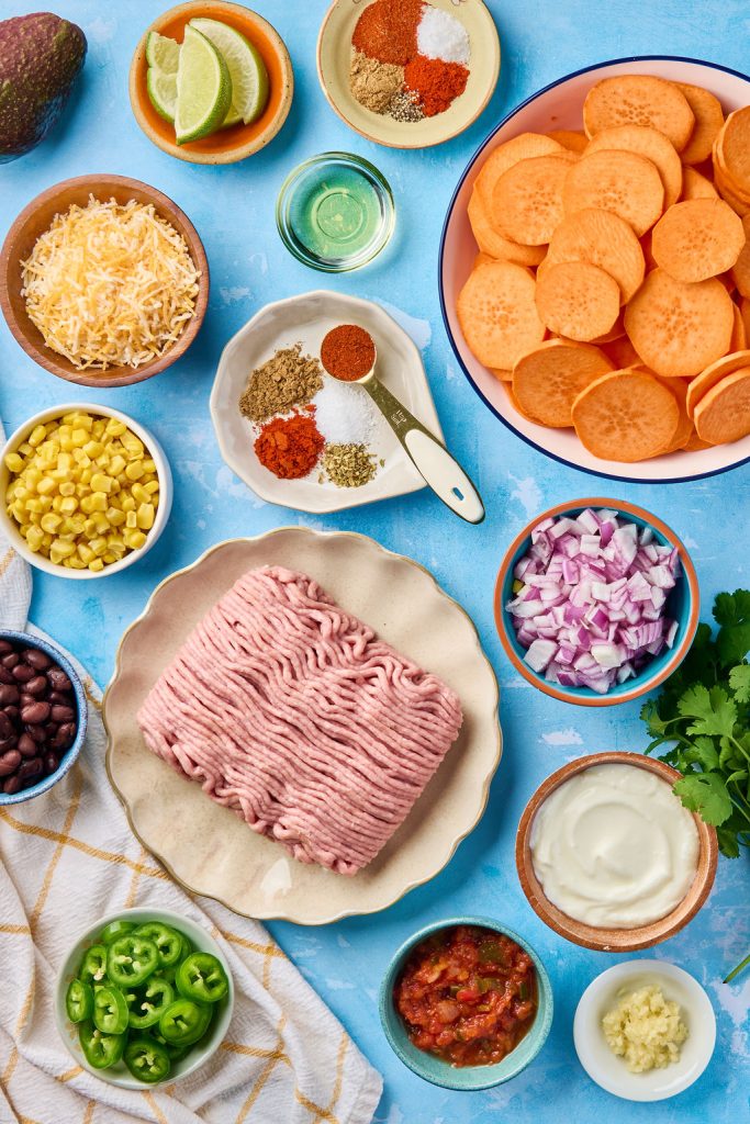 all the ingredients you need to make these sheet pan nachos on a plate