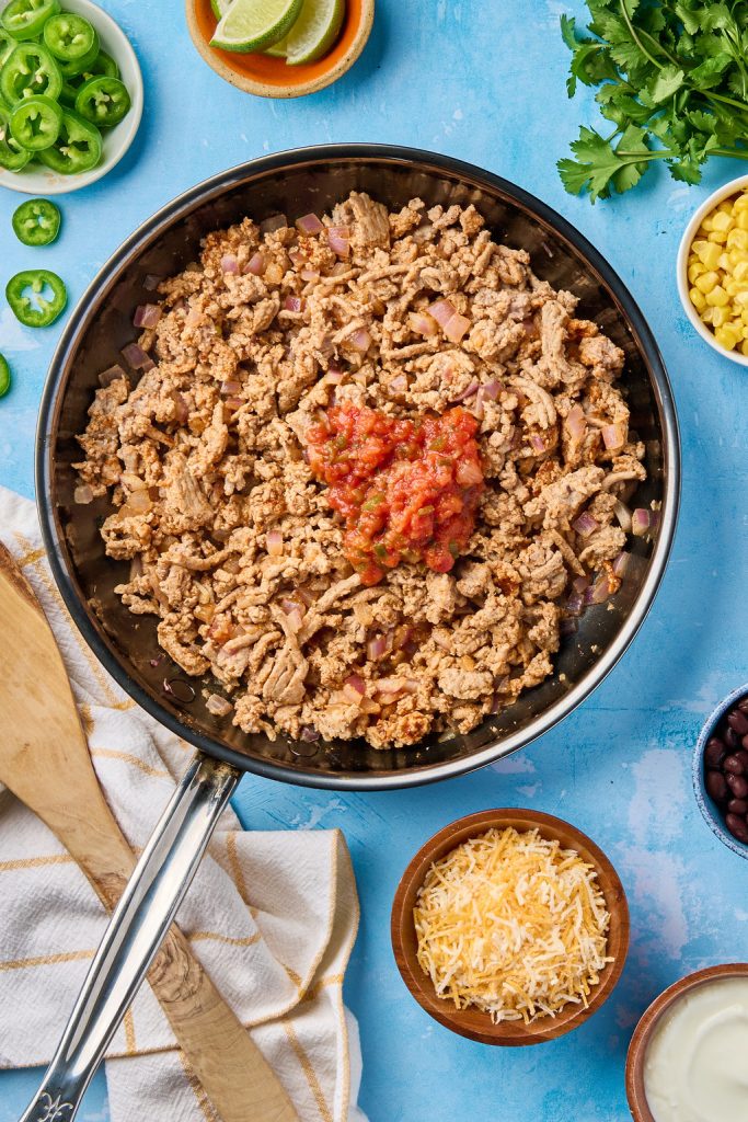 salsa added to ground turkey in a sauce pan