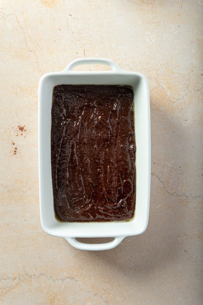 brownie batter poured into a baking dish