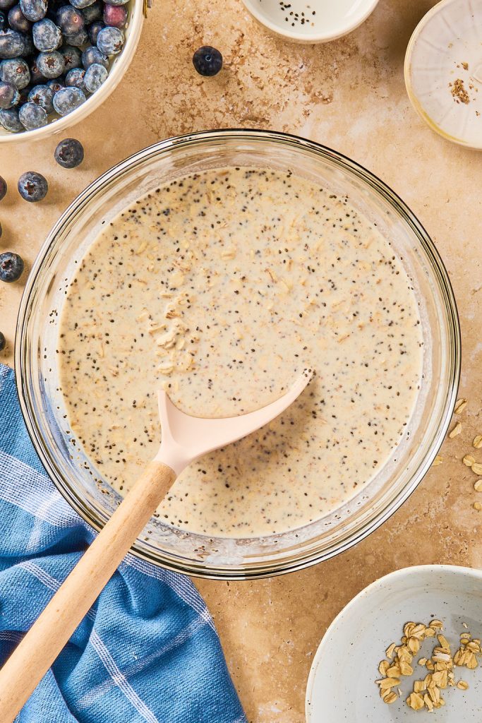oats, chia seeds, and ground flaxseed mixed together in a glass bowl