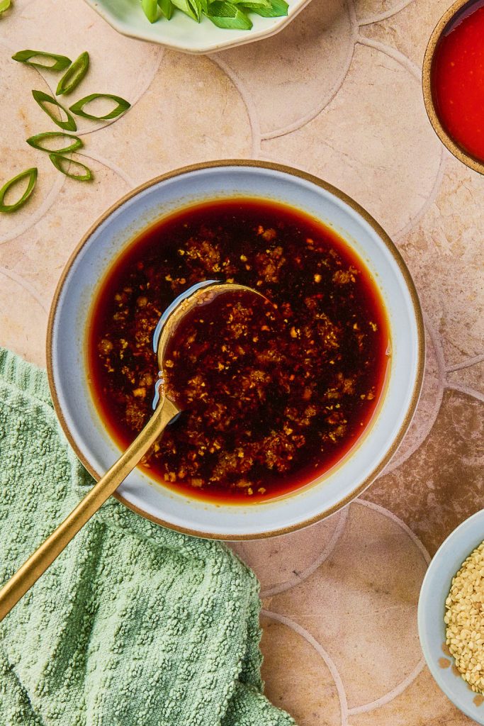 sauce ingredients in a bowl with a gold spoon