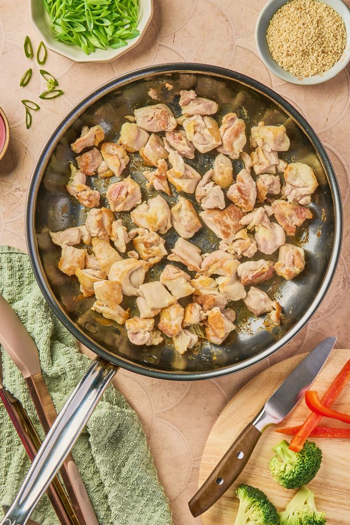 chicken being cooked in skillet