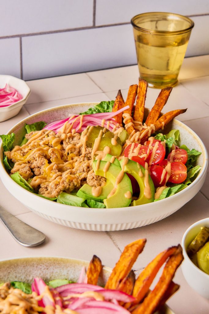 turkey burger bowl drizzled with greek yogurt sauce.