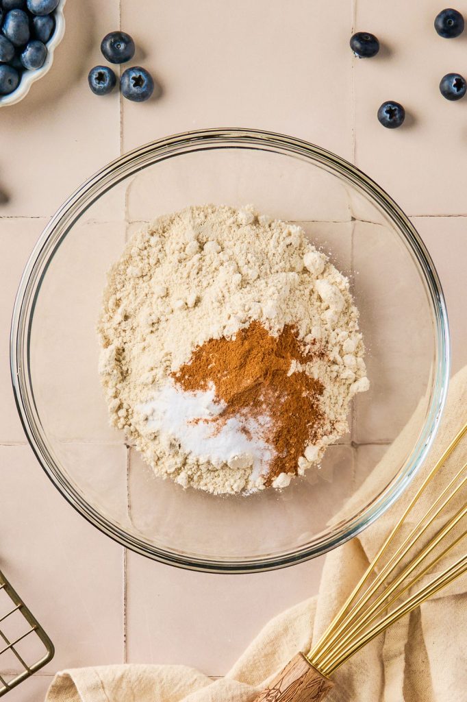 oat flour, baking soda, and cinnamon in a bowl