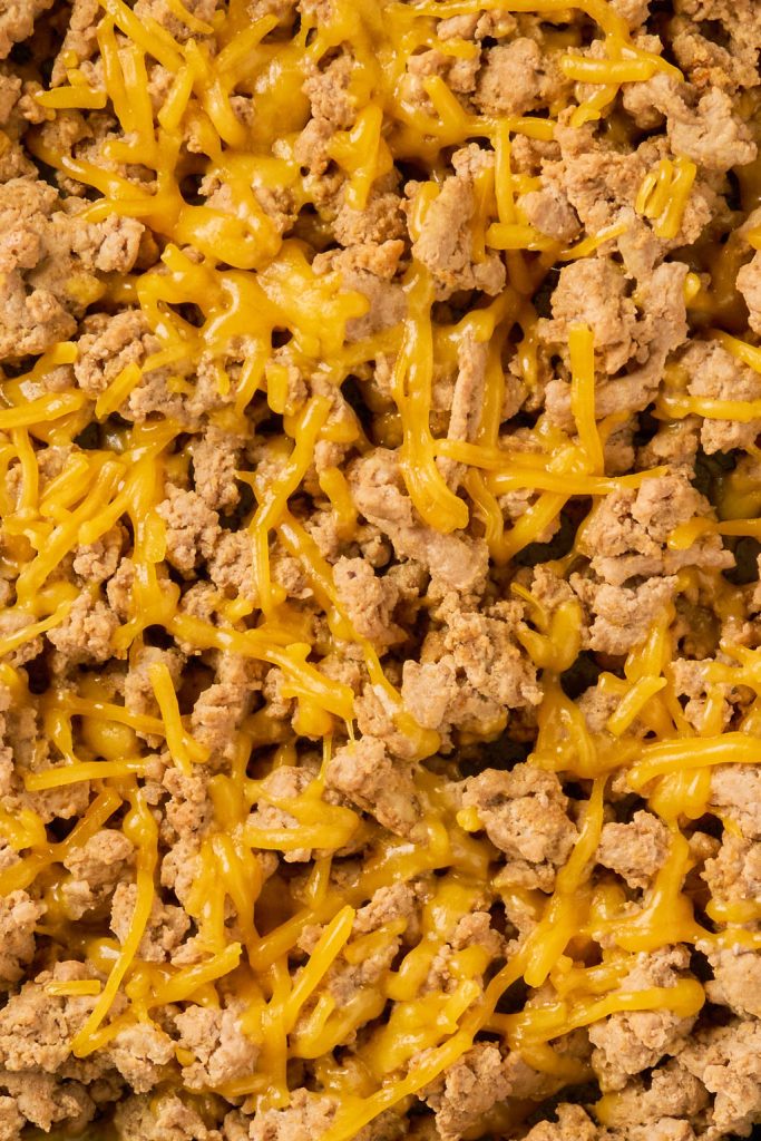 close up of cheese melting on ground turkey