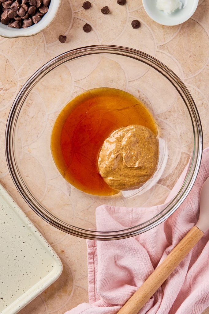 maple syrup, almond butter, and vanilla in a glass bowl