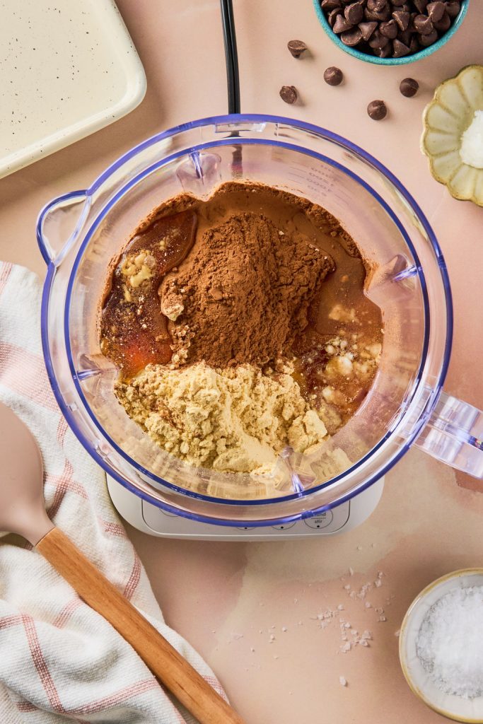 cottage cheese, cacao powder, protein powder, and maple syrup in a blender