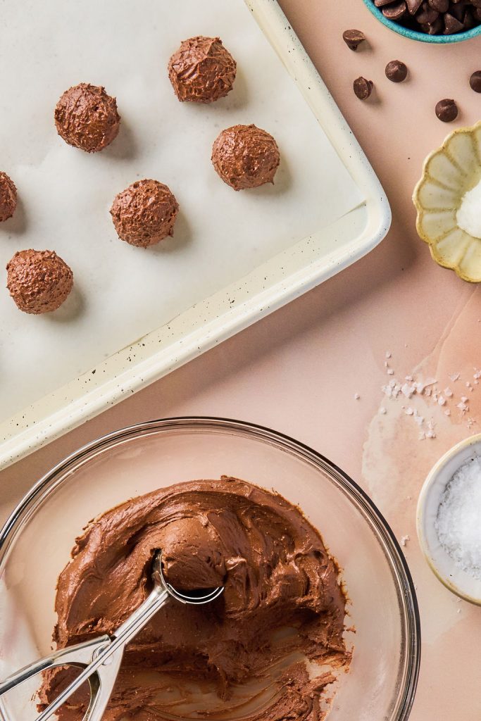 batter rolled into bite sized balls and placed on a baking sheet