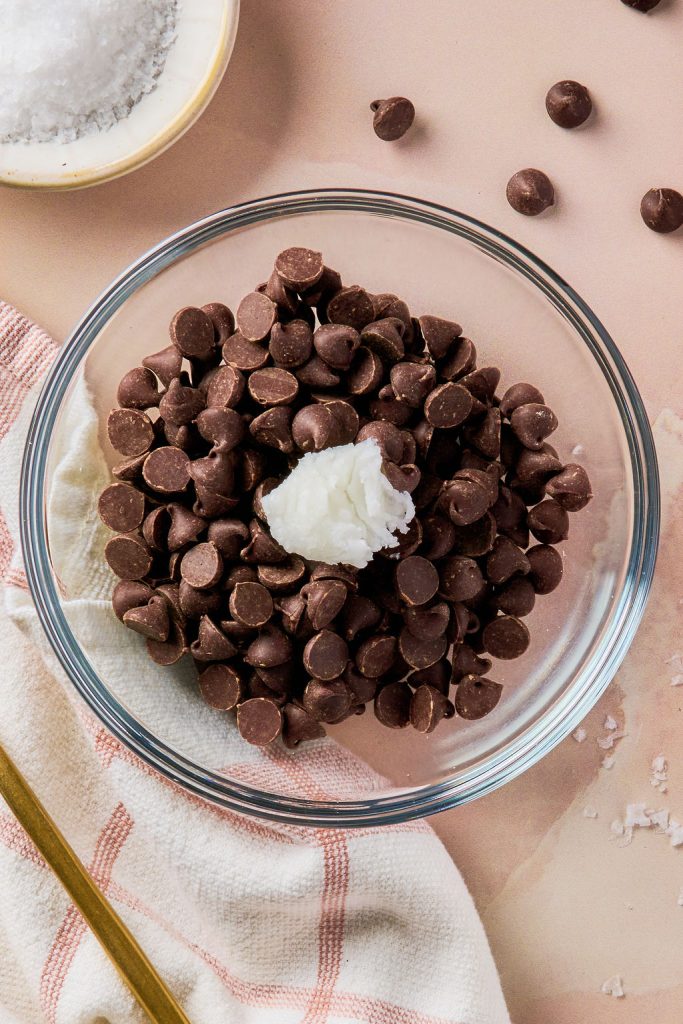 chocolate chips and coconut oil in a glass bowl