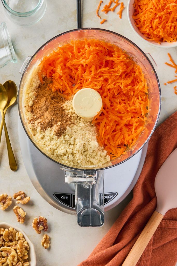 almond flour, spices, salt, and grated carrots added to the food processor