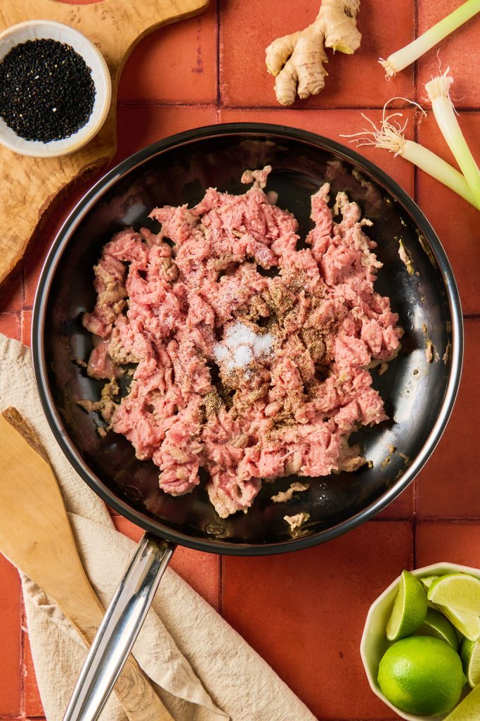ground turkey in a skillet with seasonings