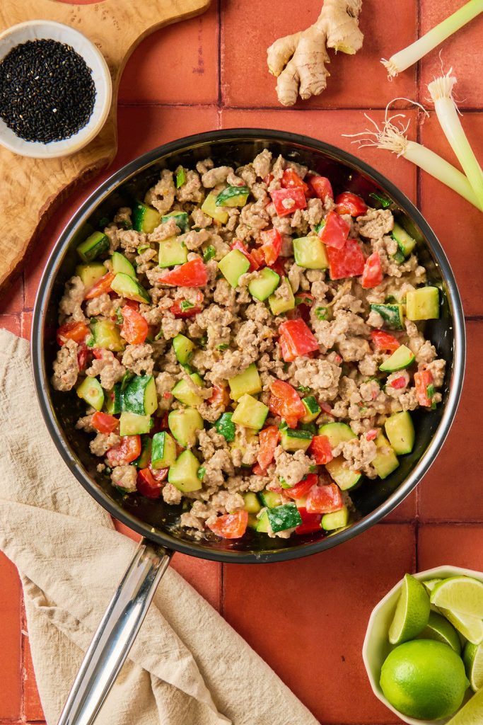 meat and veggies coated in the bang bang sauce
