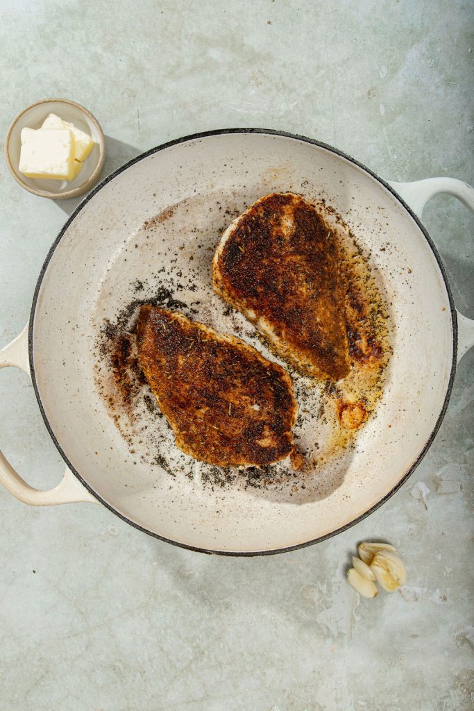 seared chicken breasts in a skillet