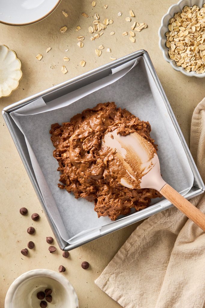 batter being poured into baking tray