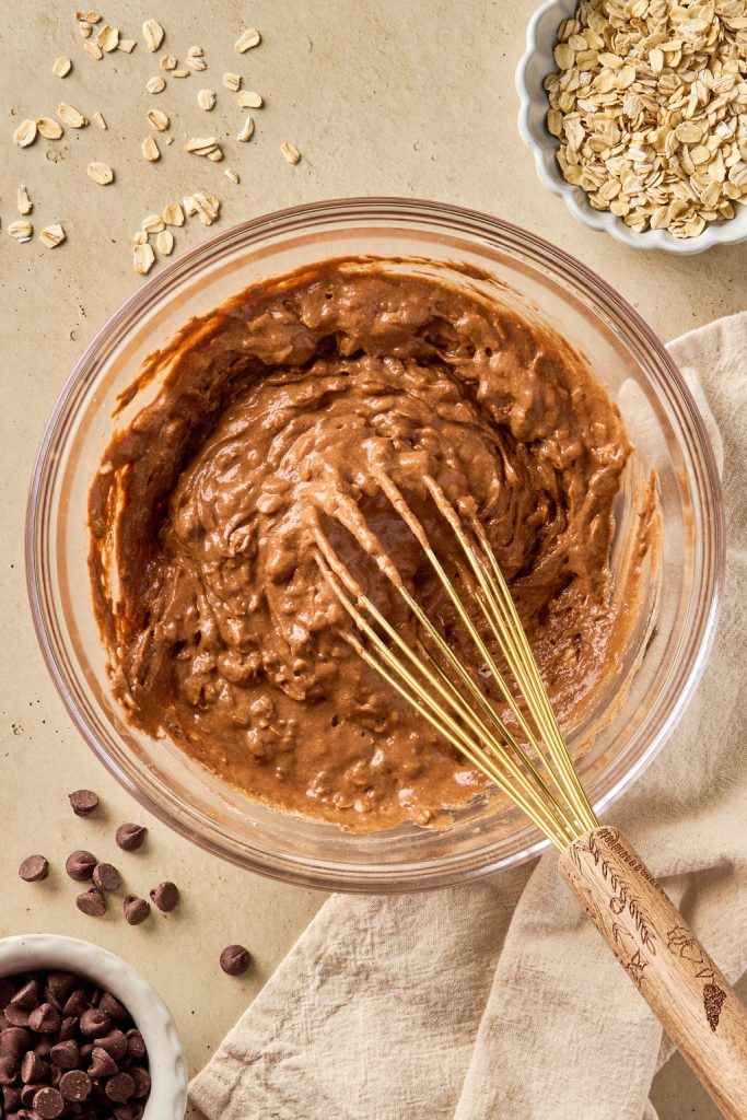 brownie batter whisked together in a glass bowl
