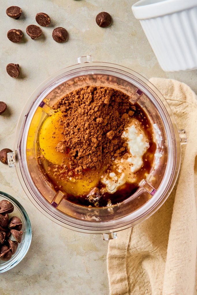 eggs, cocoa, and maple syrup added to the blender