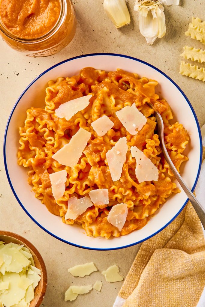 hidden veggie pasta sauce over pasta in a bowl, topped with parmesan cheese
