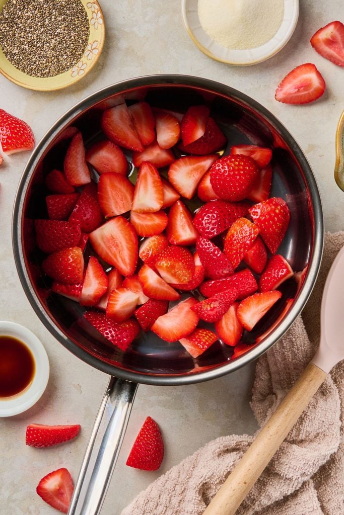 cut strawberries in a sauce pan