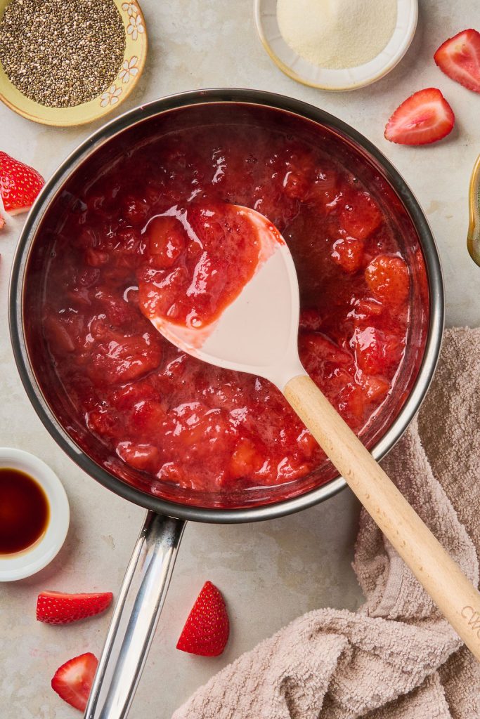 strawberries heated up in sauce pan to make them soft and jammy
