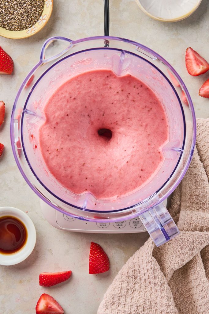 strawberry mixture added to a blender and blended until smooth