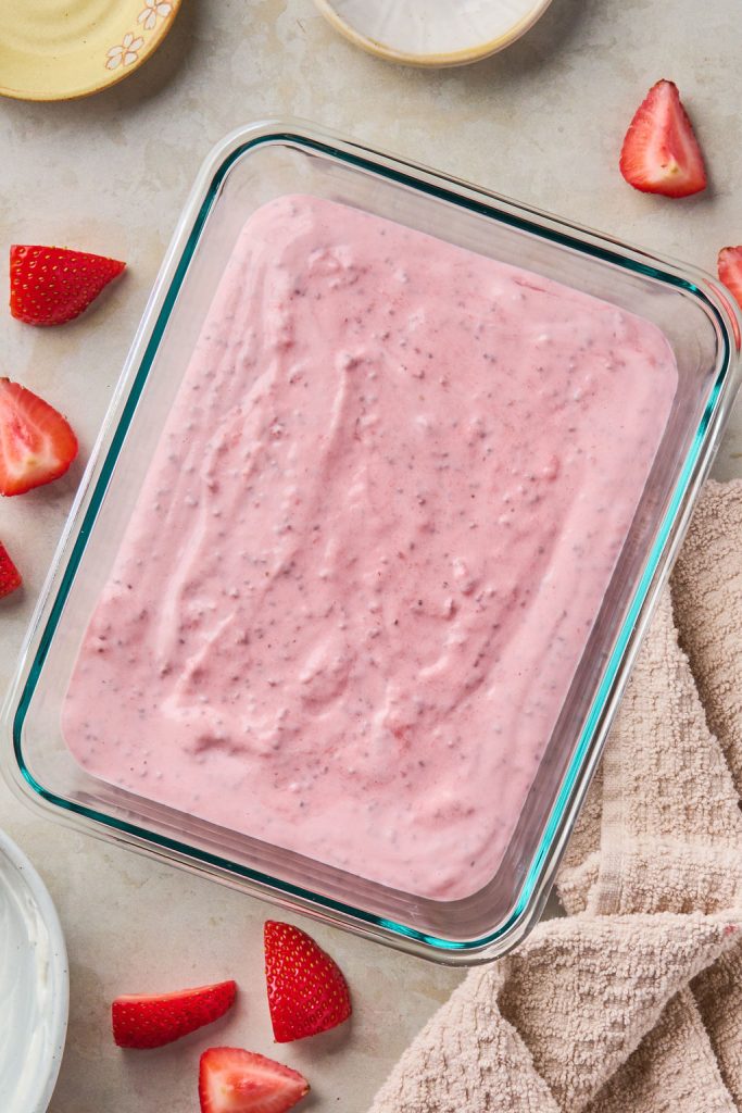 greek yogurt jello poured into a baking dish