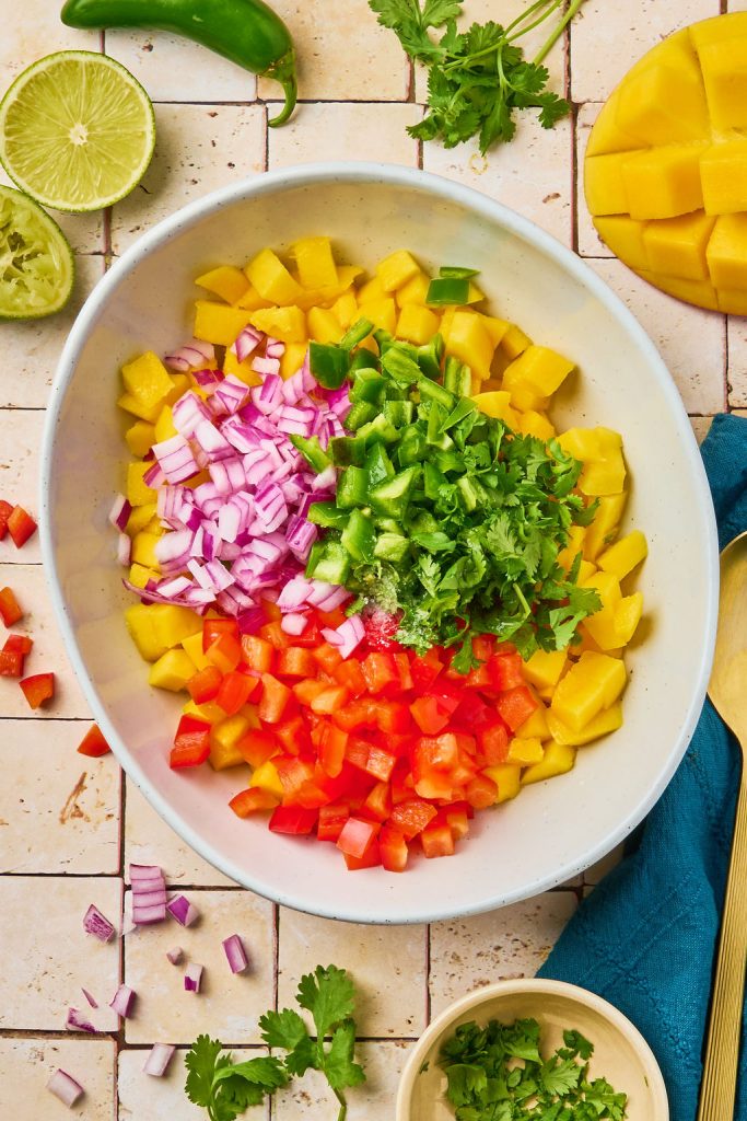 all the mango salsa ingredients in a bowl