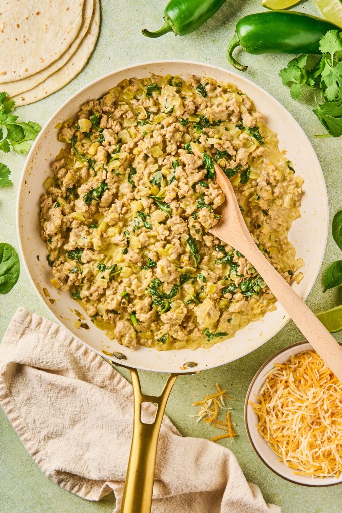 cheese and greek yogurt mixed into the ground turkey mix to create enchilada filling