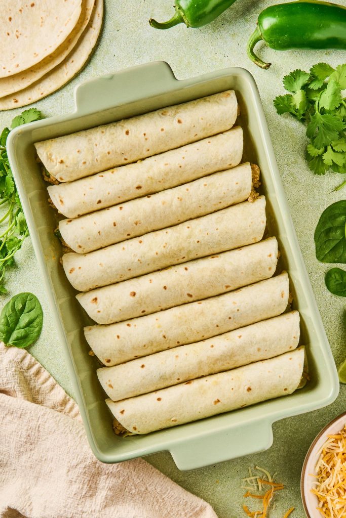 enchiladas rolled and placed in baking dish